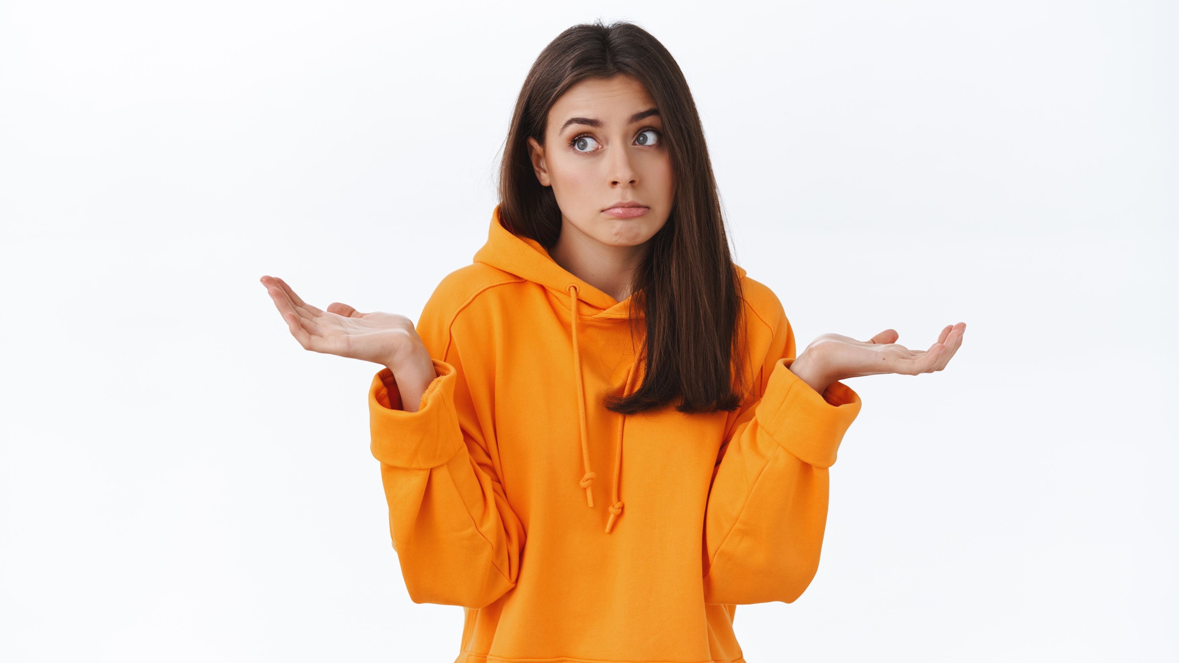 Woman with gesture of not knowing anything in an orange jacket